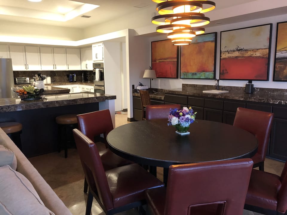 Wet bar, 6 person round table for eating or playing cards, games, or watching TV