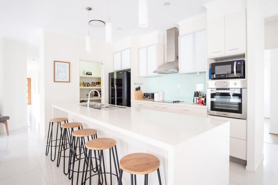 Island seating provided in the kitchen.