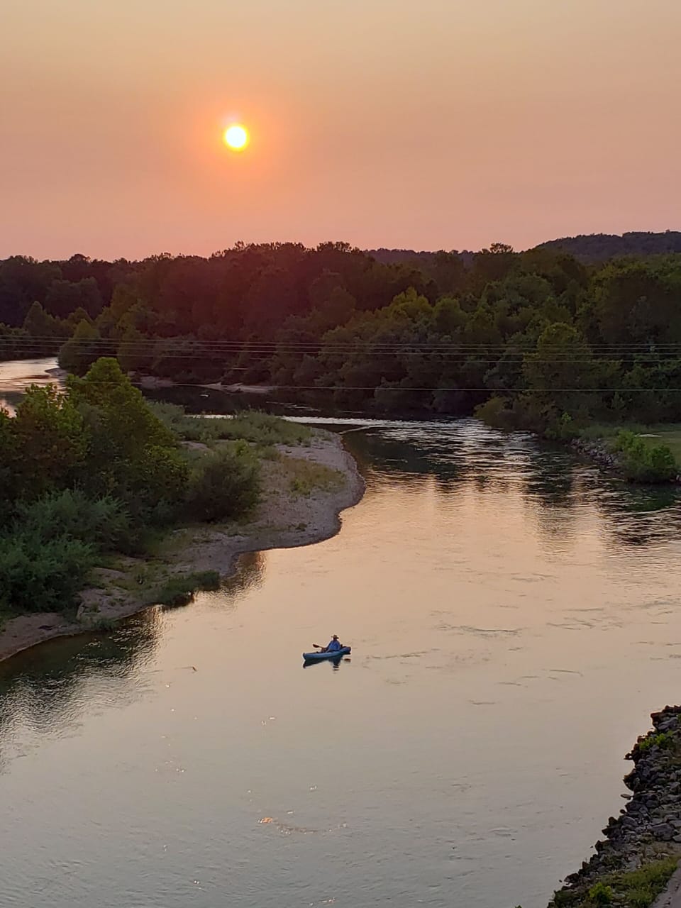 Sunset over Current River.  Kayak in front of Condo.