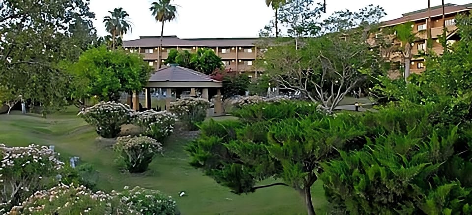 Stroll through manicured gardens surrounded by peaceful greenery.