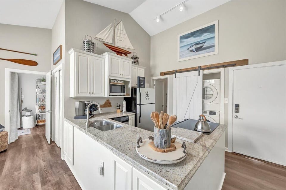 A fully equipped kitchen complete with a Keurig coffee maker and assorted pods