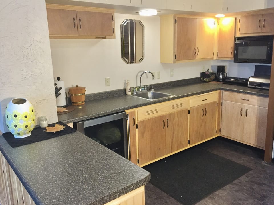 Spacious kitchenette, sink, mini-fridge, microwave, hot plate and toaster oven. 