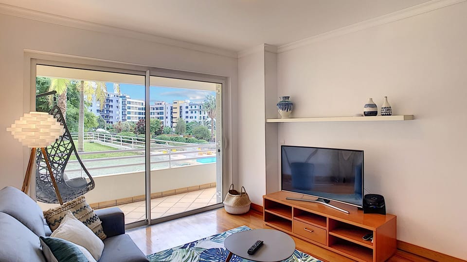 Stylish and comfort living room #tropicalstyle #smartTV #balcony #pool