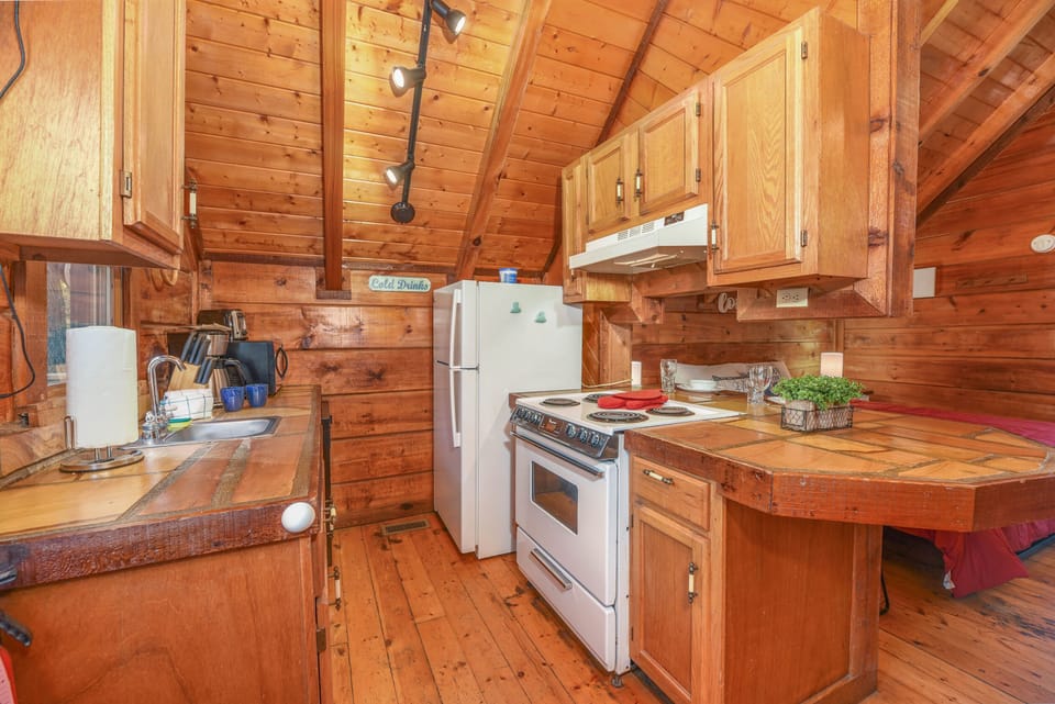 Galley style kitchen with dishwasher, oven and stove