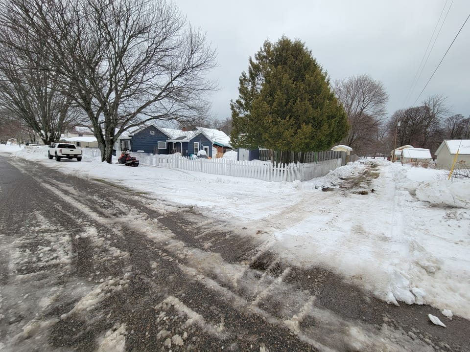 40 ft of alley parking for your trailer. We keep this plowed for winter guests.