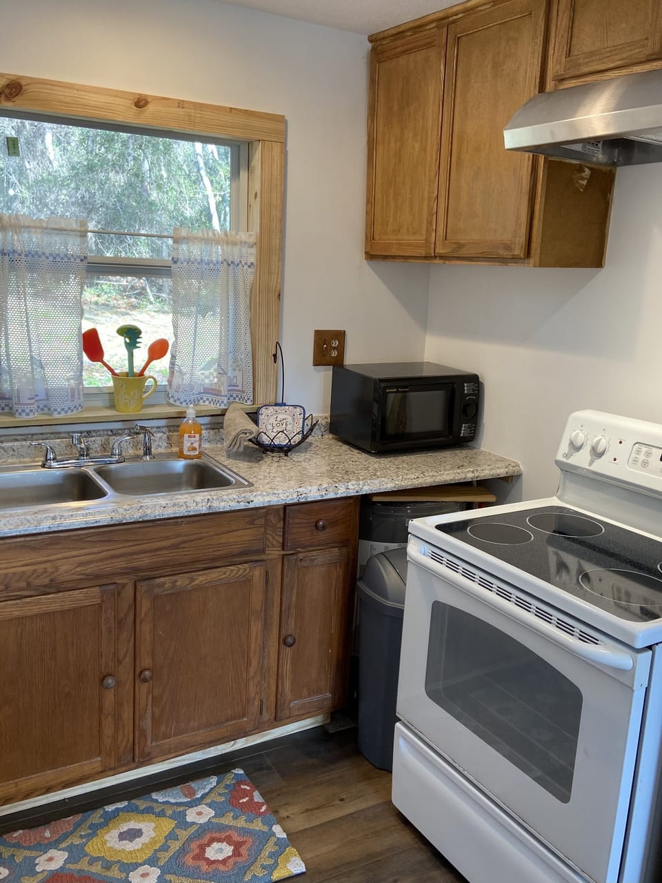 Kitchen w/elec. range, refrigerator, toaster, microwave &12-cup coffee maker
