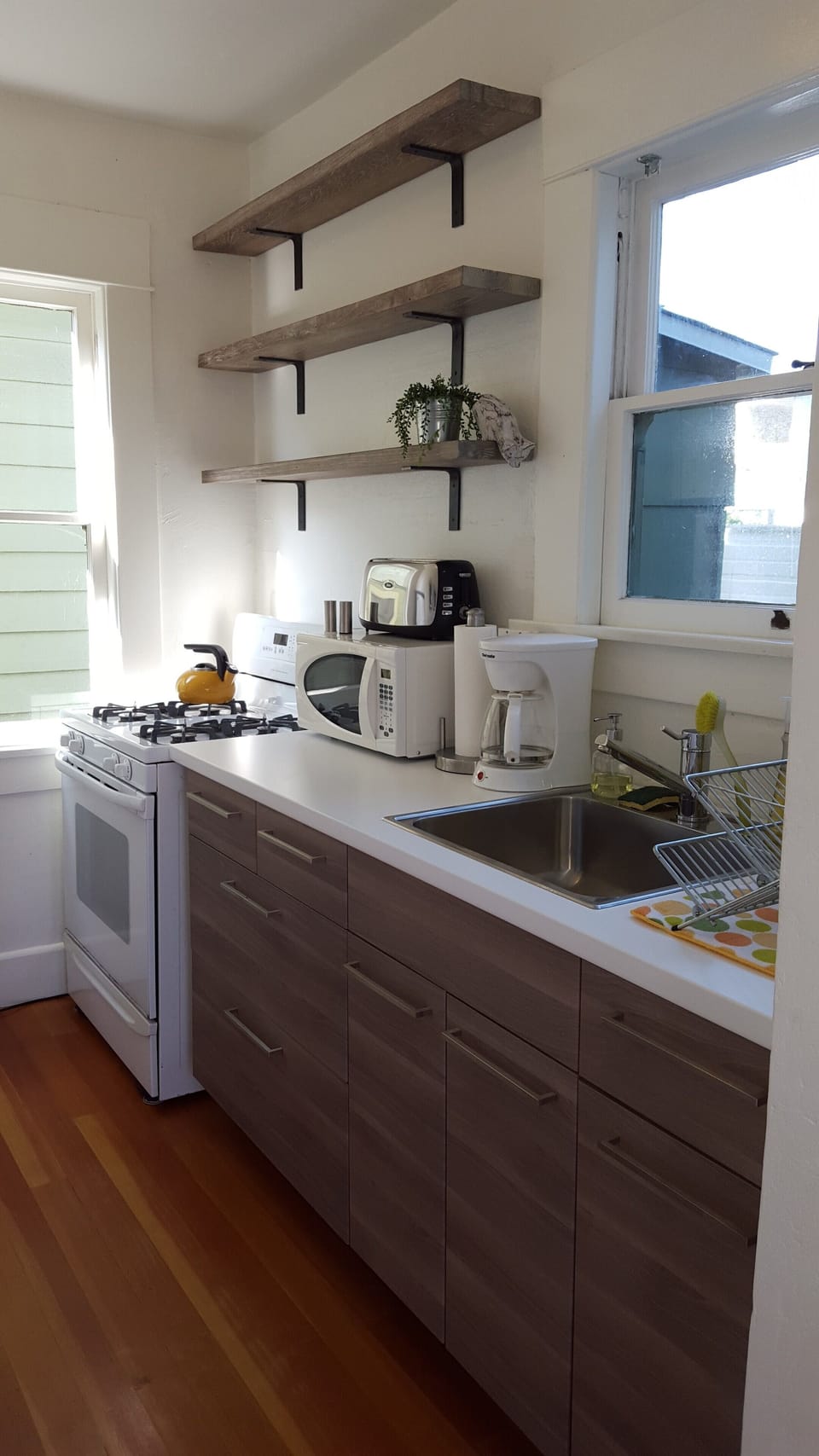 Kitchen, w/gas stove, oven, refrigerator, microwave, toaster, & coffee maker