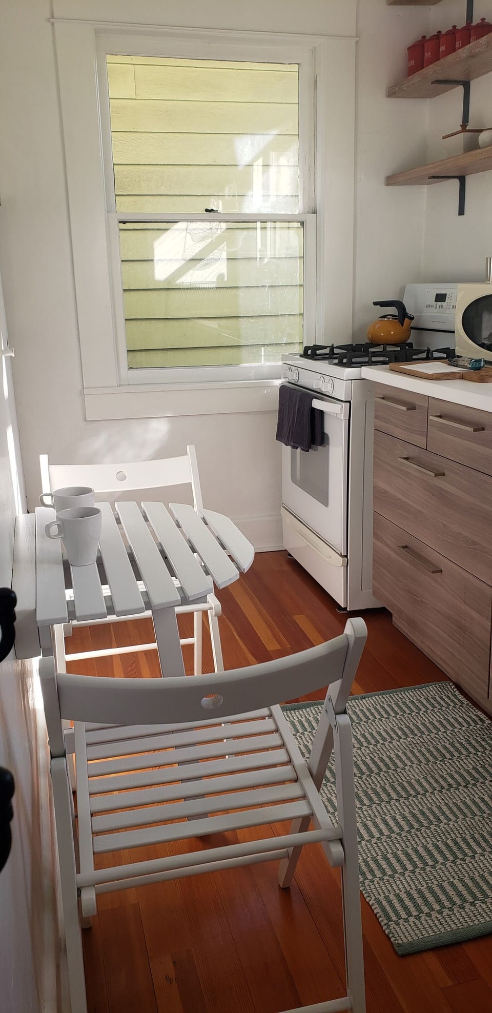 Well equipped kitchen with full-size stove, refrigerator, microwave, etc.