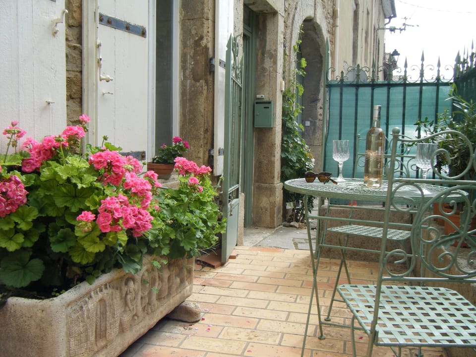Private courtyard on the ground floor next to garage.
