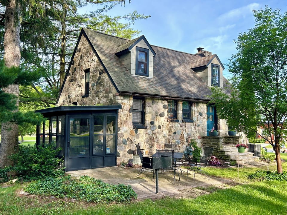 Relaxing patio off the porch with a park style grill for cooking out. 