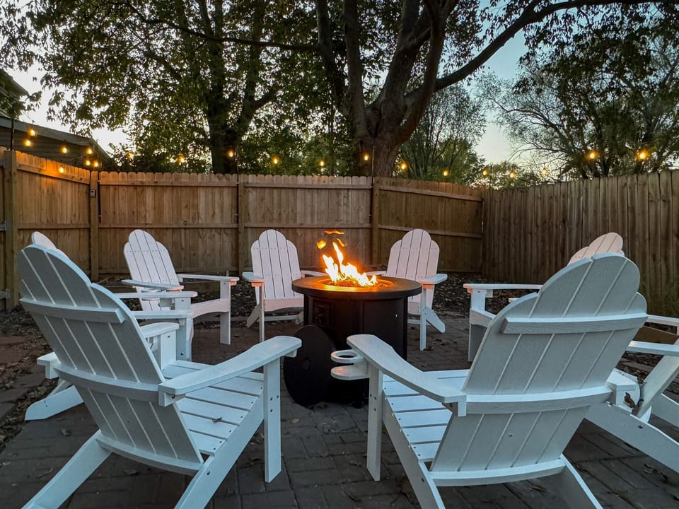 Propane fire pit with ample seating. Private and spacious fully fenced in yard at the Bank Haus