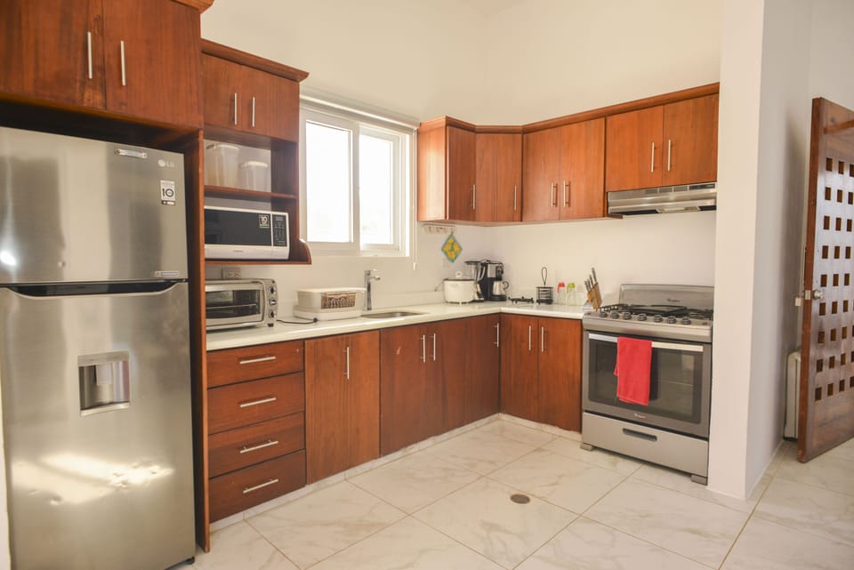 Kitchen Includes:

Oven
Microwave
Cooking Knives
Cooking Utensils
Blender
Fridge
