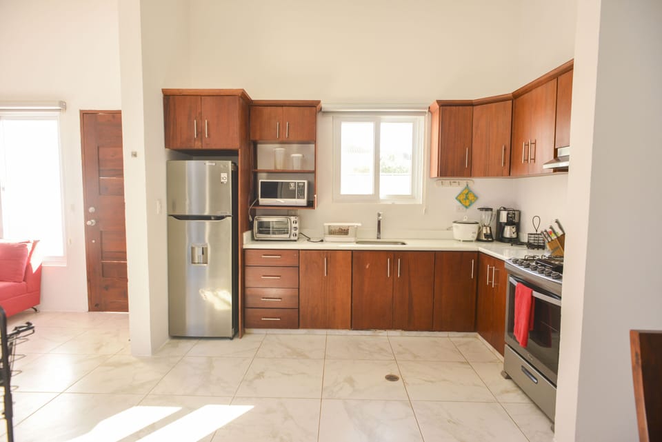 Kitchen Includes:

Oven
Microwave
Cooking Knives
Cooking Utensils
Blender
Fridge