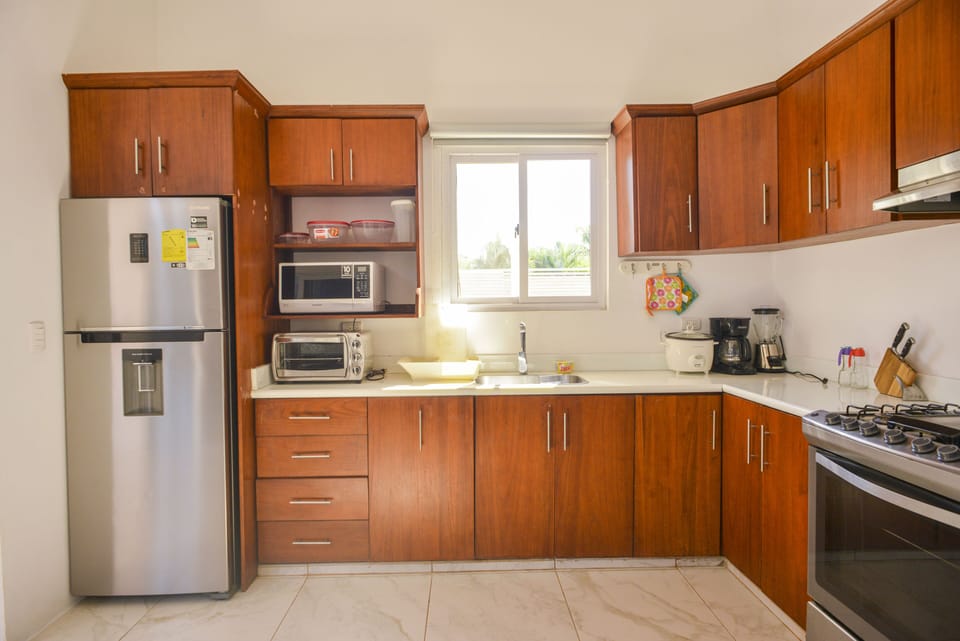 Kitchen Includes:

Oven
Microwave
Cooking Knives
Cooking Utensils
Blender
Fridge