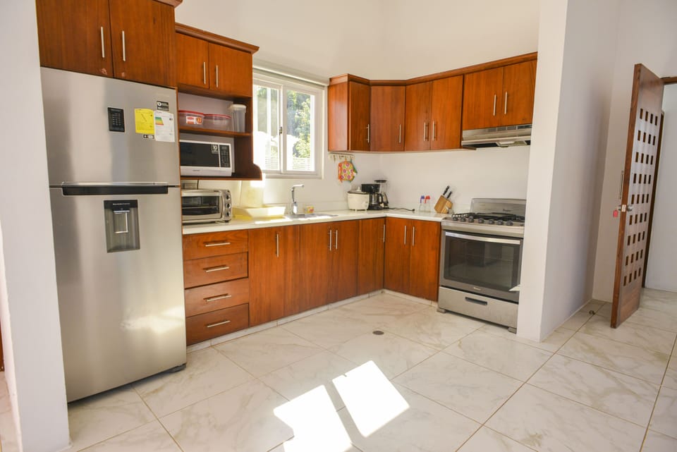 Kitchen Includes:

Oven
Microwave
Cooking Knives
Cooking Utensils
Blender
Fridge