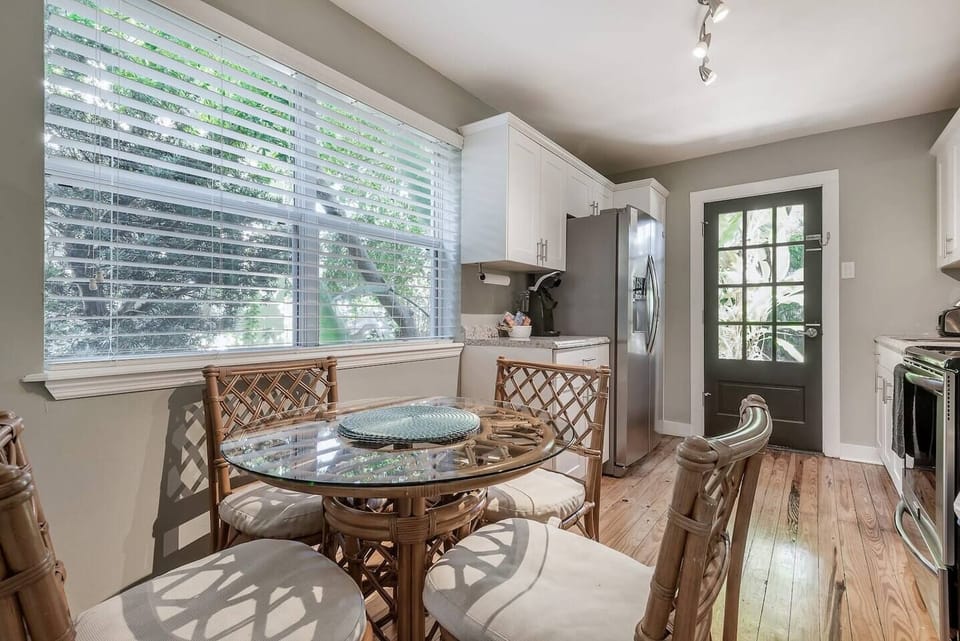 Kitchen Oasis: Bright and airy space with modern appliances and charming glass-top dining!