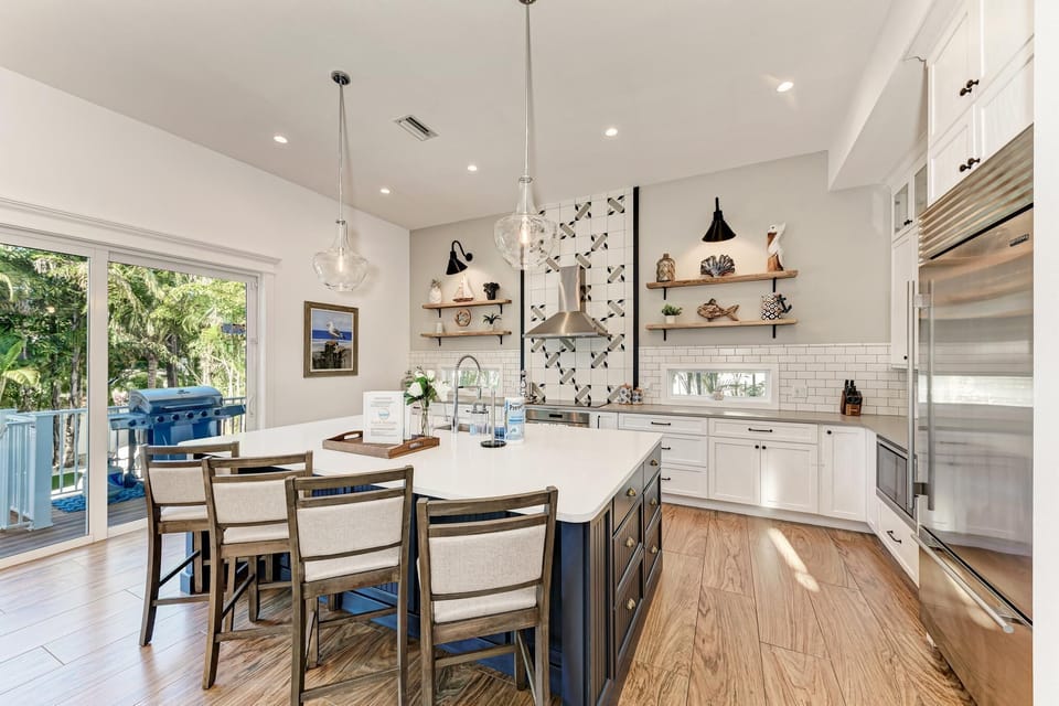 Custom coastal kitchen with oversized island