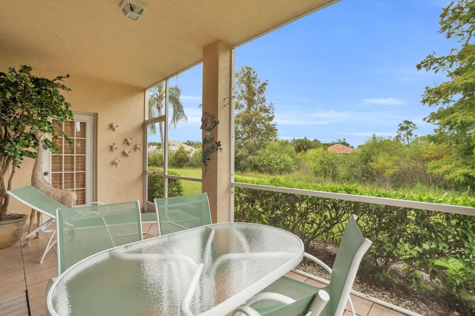 The lanai is adjacent to a natural preserve and has a peaceful view