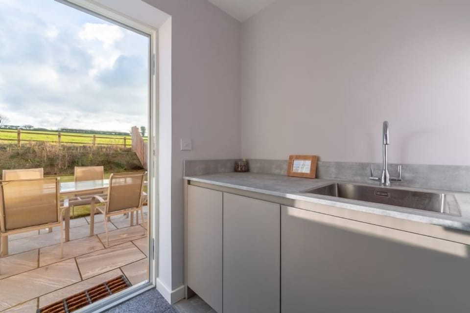 Ground floor: Utility room with door leading into the garden