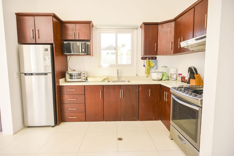 Kitchen Includes:

Oven
Microwave
Cooking Knives
Cooking Utensils
Blender
Fridge