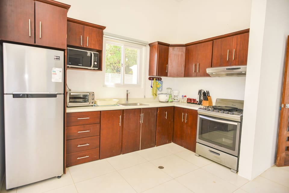 Kitchen Includes:

Oven
Microwave
Cooking Knives
Cooking Utensils
Blender
Fridge