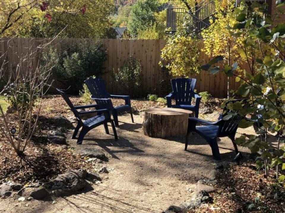 The Back yard has a BBQ, dining veranda, and casual seating. The space is shared with other guests.