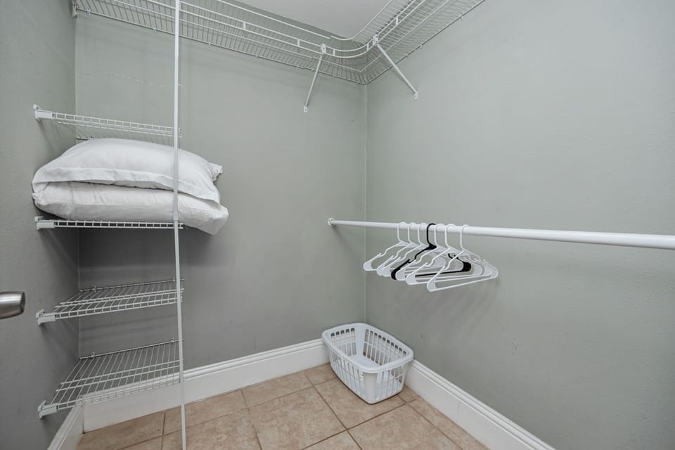 Storage Space: Ample shelving and hangers for your vacation gear in this practical closet!