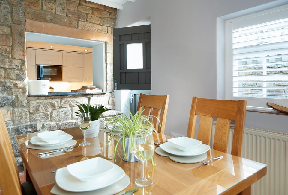 Ground floor: Spacious dining room with serving hatch to kitchen