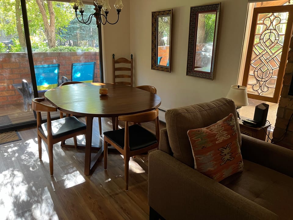 Dining area with patio and gas grill.