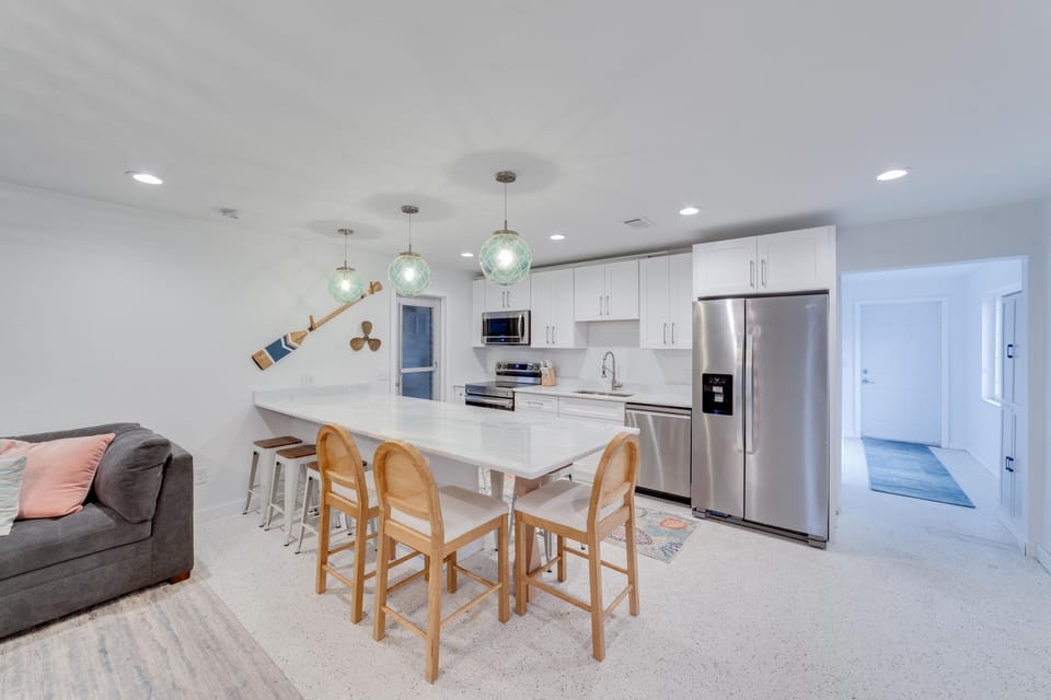 Kitchen view with hallway leading to the back yard oasis.