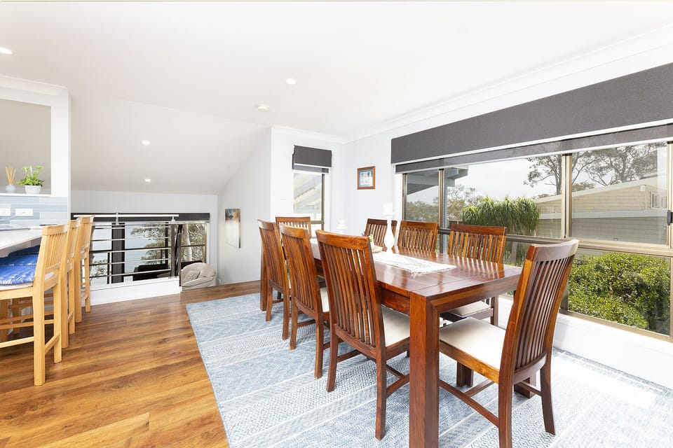 Dining area with open plan living including kitchen and lounge room