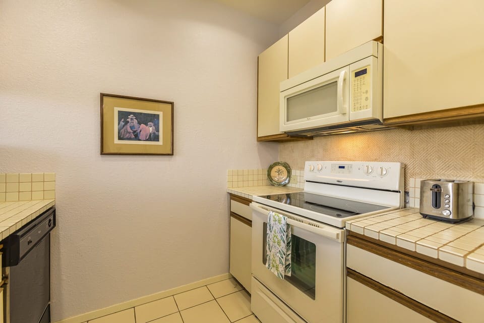 Glass top stove~ oven~ microwave~ toaster and dishwasher.