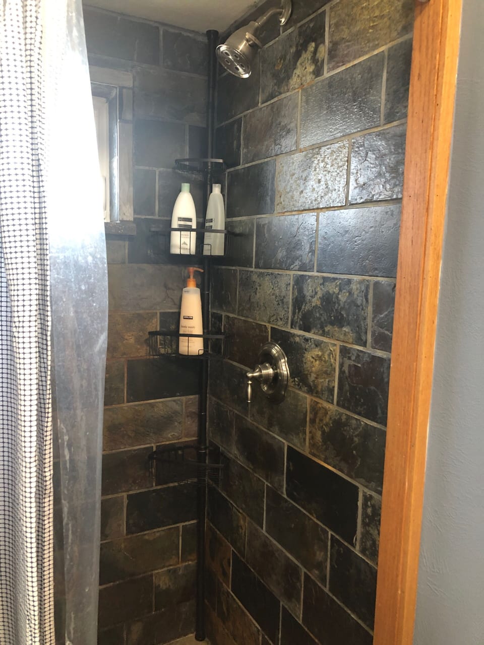 Bathroom #2 tiled shower. Shampoo, conditioner and body wash provided.