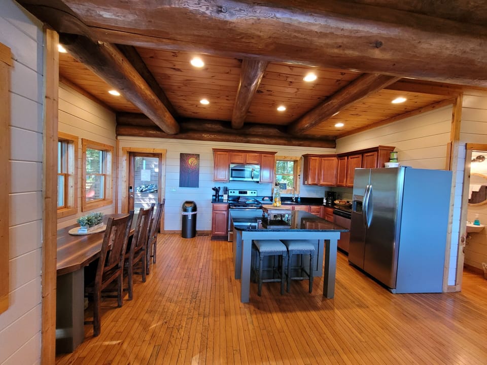 Kitchen and indoor dining on middle floor