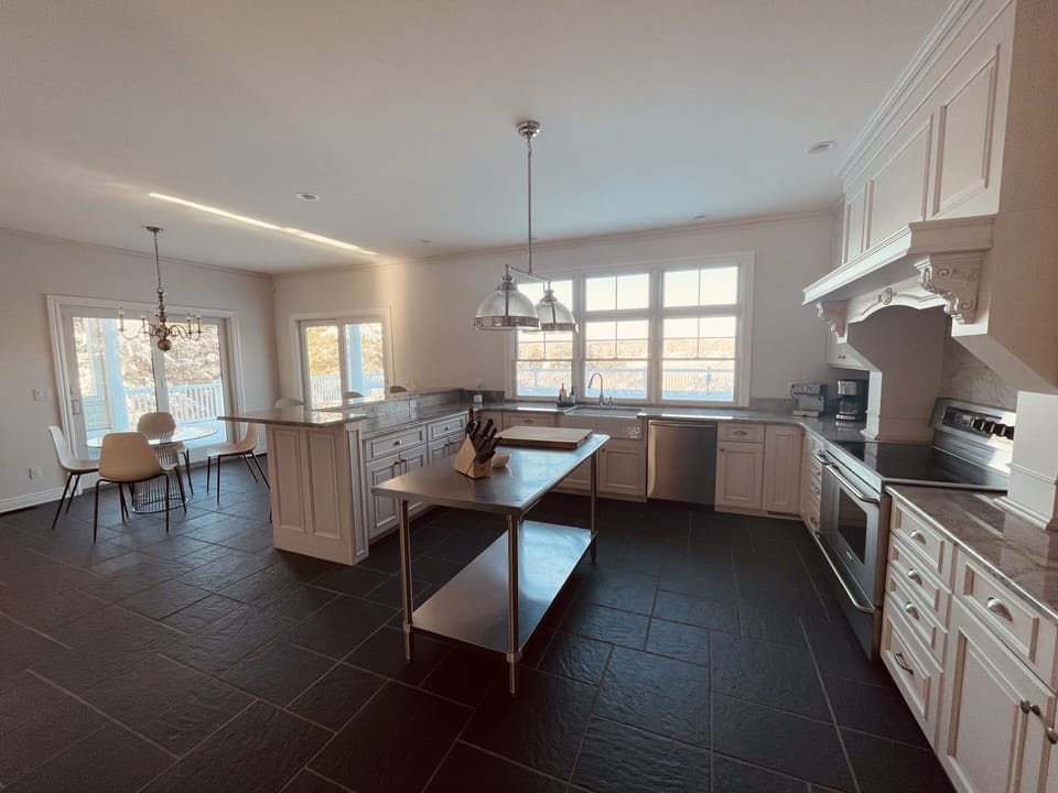 Very large eat in kitchen with huge island and breakfast table 