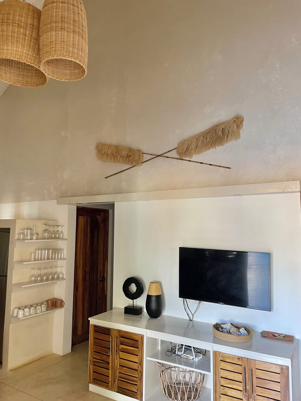 tv and console inside villa