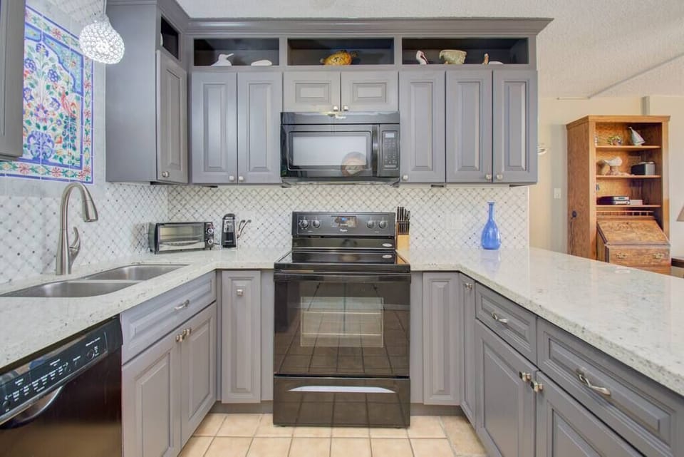This kitchen is fully equipped with a lots of room to gather. 