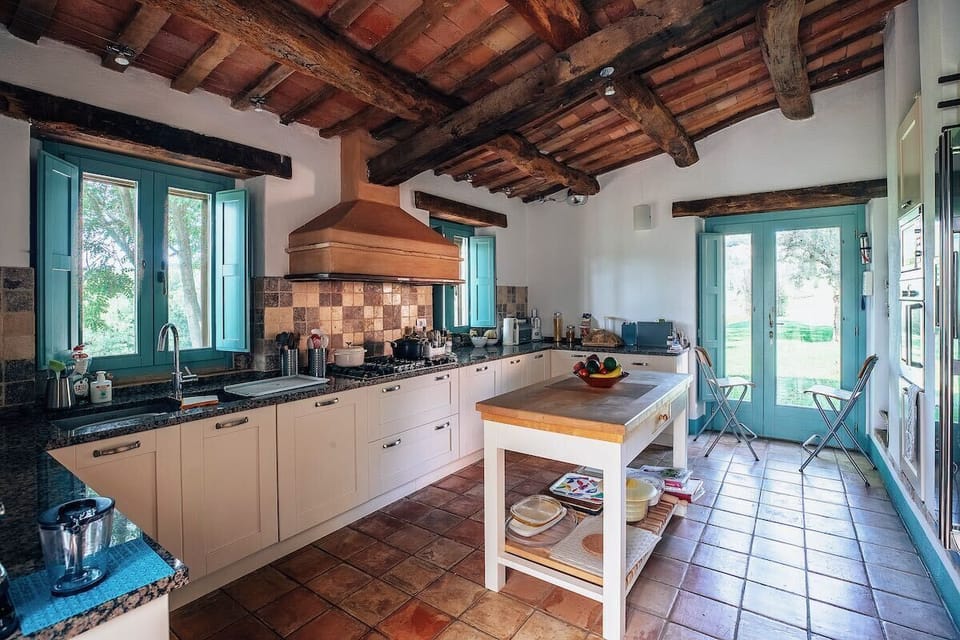 Very spacious kitchen with central work unit, extensive granite working surfaces