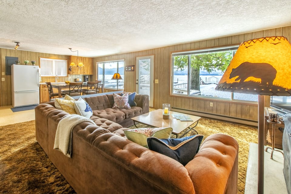 Kitchen and living room with lake and mountain views 