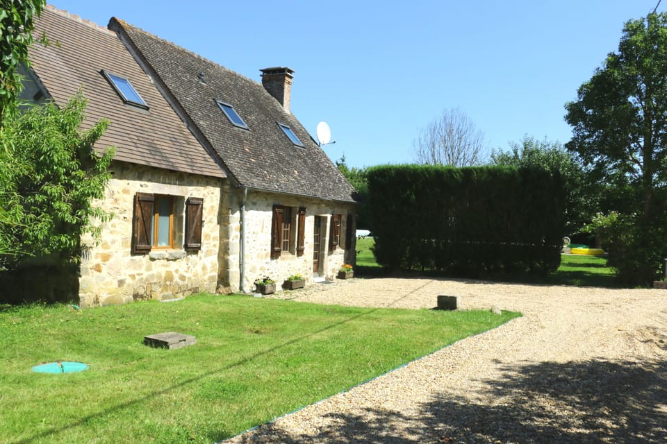 Front of gite, parking area and drive from entrance gate