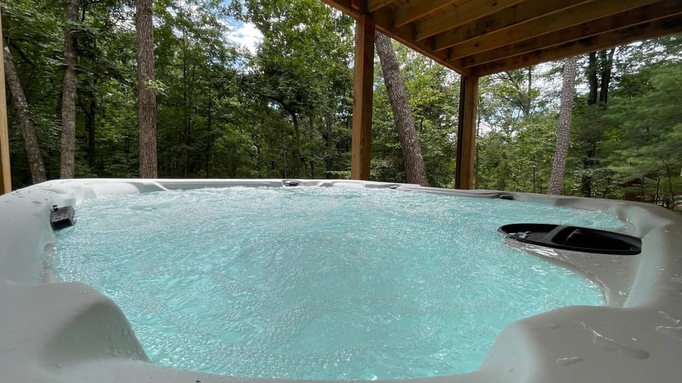 Enjoy a dip in the Hot Tub on a cool night #Cabinlife #ellijay  #sunsetview
