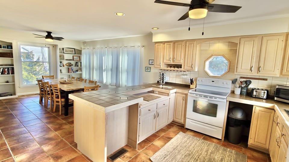 View of kitchen that also opens to dining area.