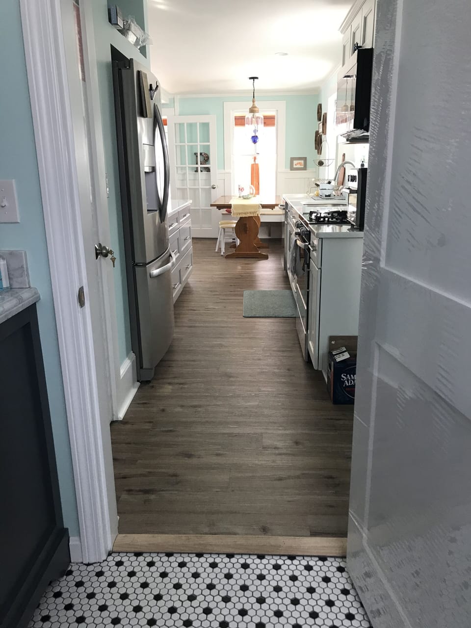 Bathroom is off of the kitchen. 