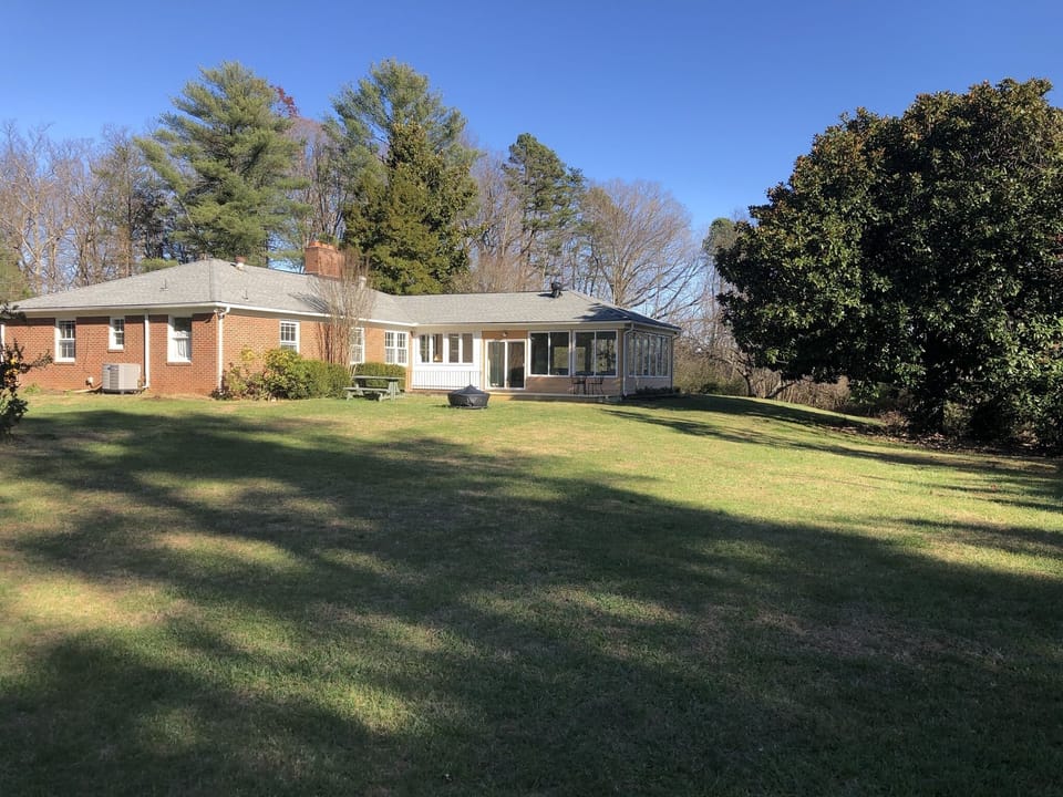 Large back yard with plenty of grass for all the yard games 