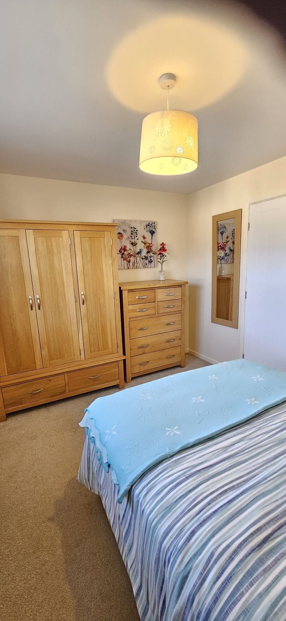 Back bedroom has solid oak furniture