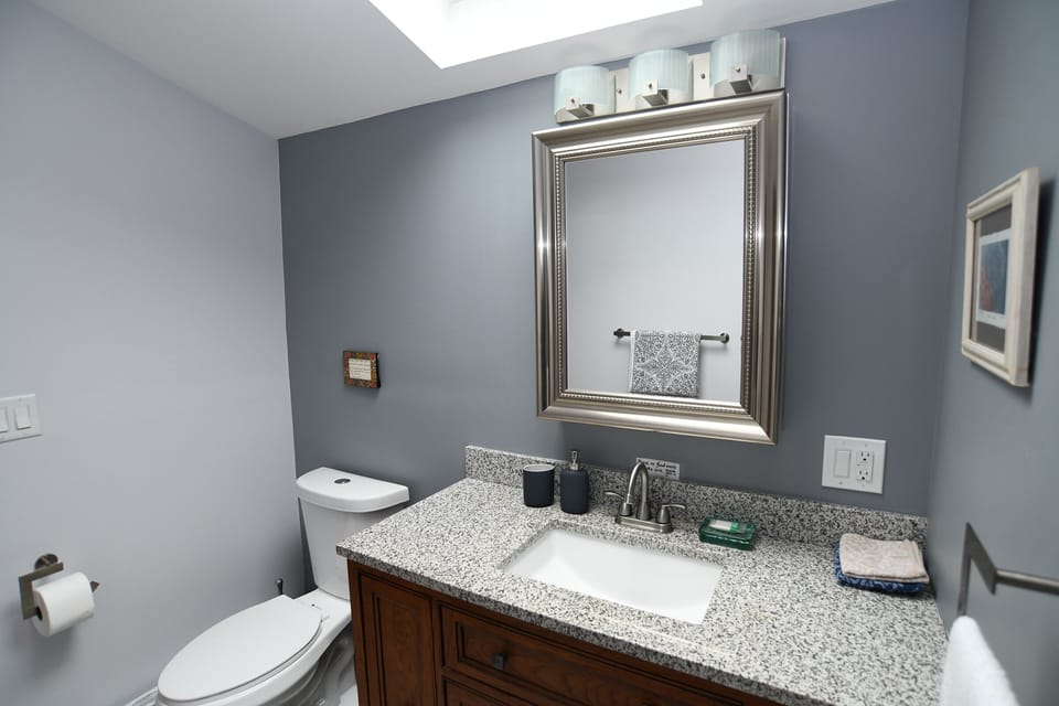 Renovated bathroom with tiled shower