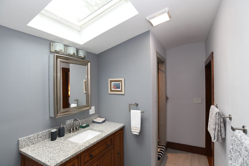 Renovated bathroom with tiled shower