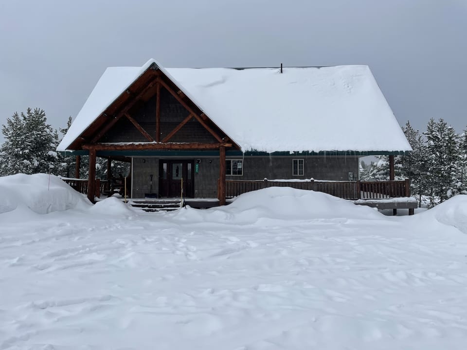 Front of cabin with parking