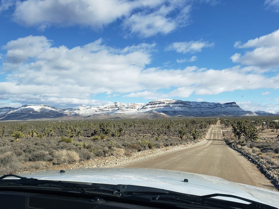 The road leading to the house with the beautiful backside of the Grand Canyon 