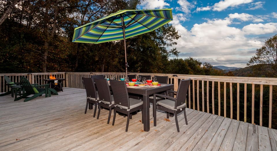 Outdoor dining with a fire feature and views